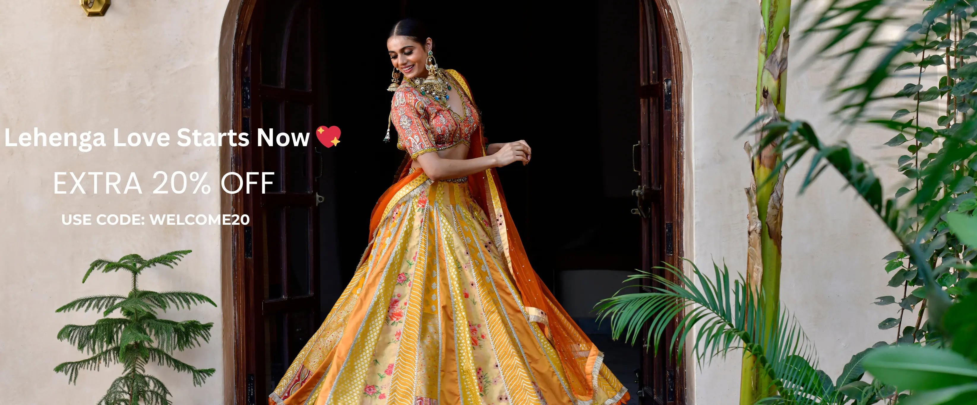Woman in a colorful lehenga standing in a doorway with promotional text overlay.